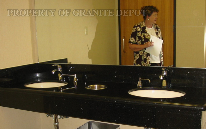 Black Galagy granite, 9" apron, 6" splash-a rest room in a bank building